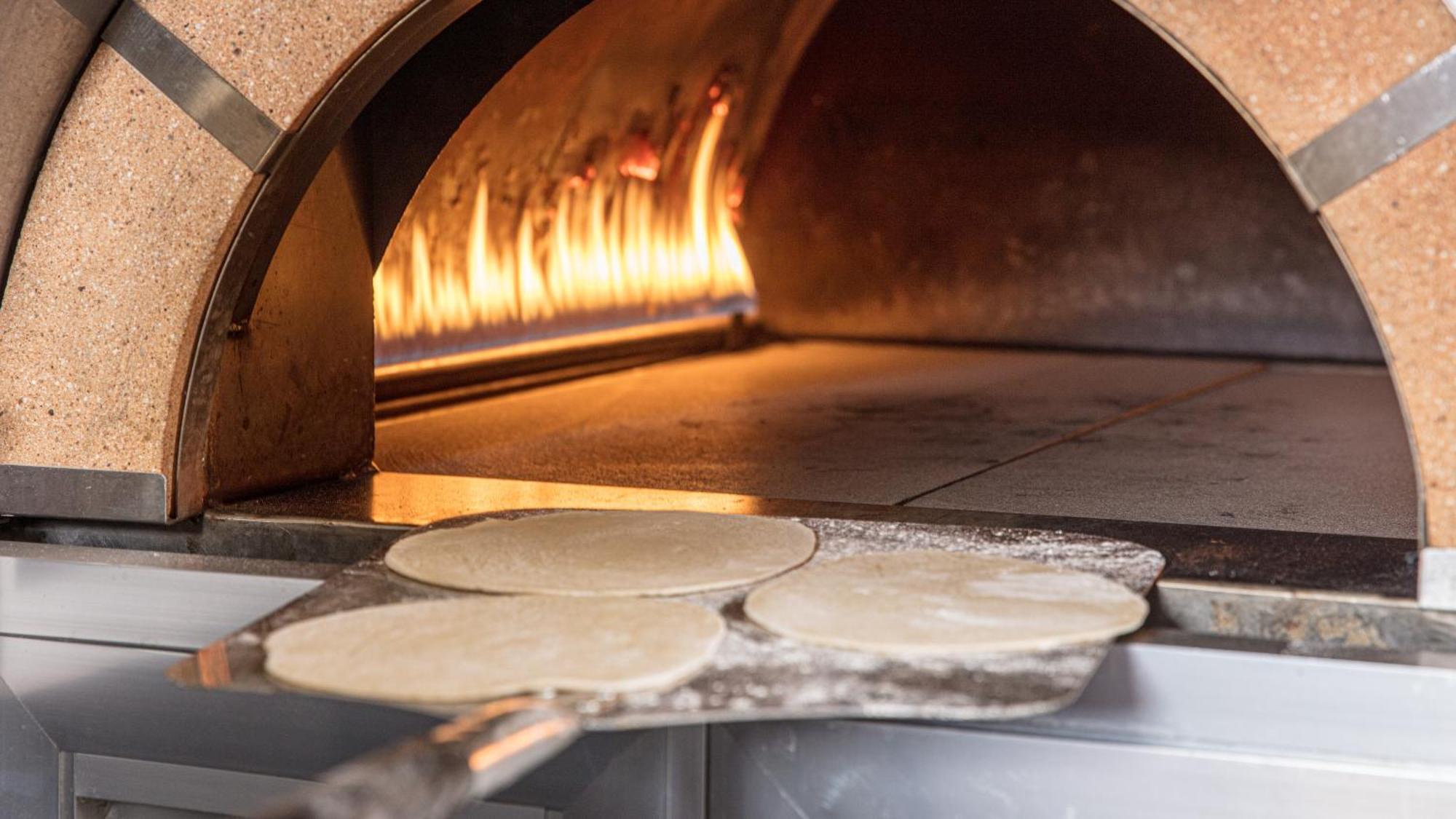 The Abdali Boulevard Hotel Amã Exterior foto Pizza dough in a wood-fired oven