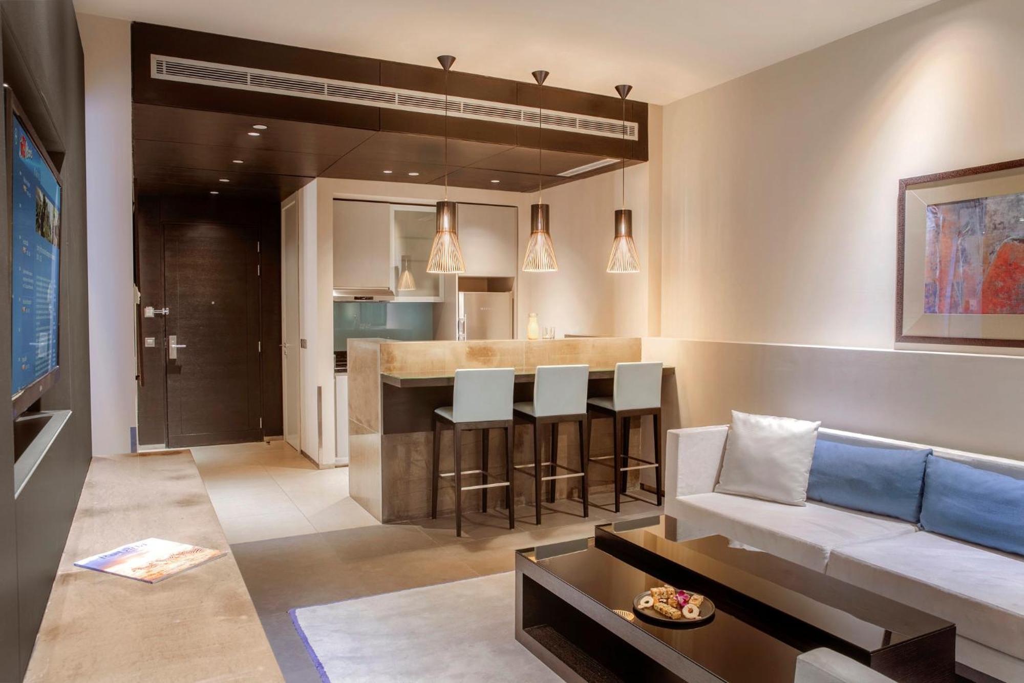 The Abdali Boulevard Hotel Amã Exterior foto A living room with a kitchenette